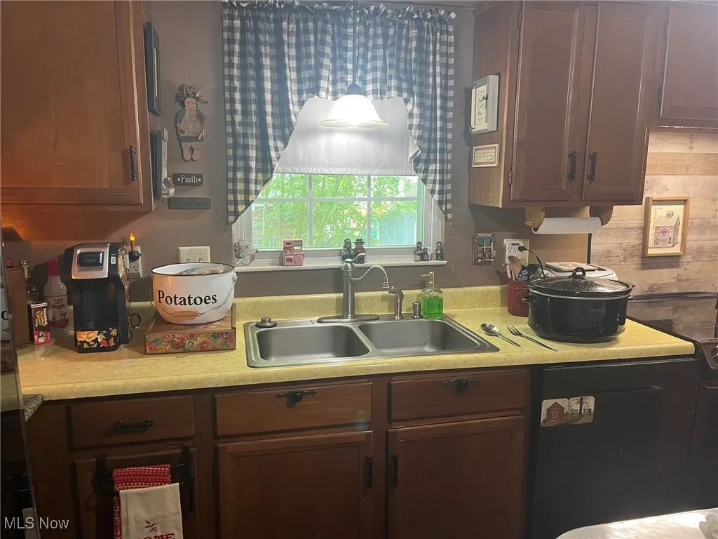 Kitchen featuring light countertops