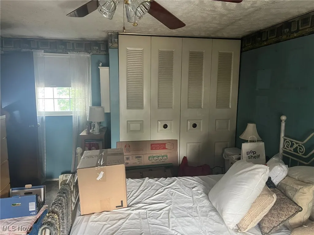 Bedroom featuring a closet and ceiling fan