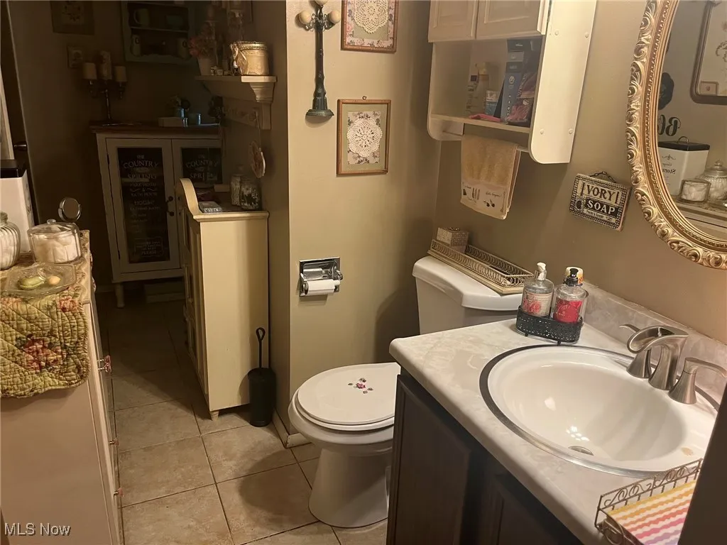 Bathroom with vanity and tile patterned flooring