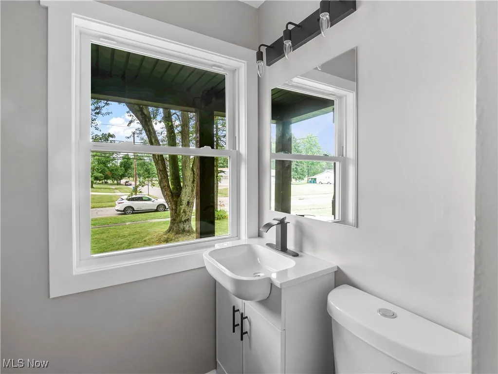 Bathroom with vanity and healthy amount of natural light