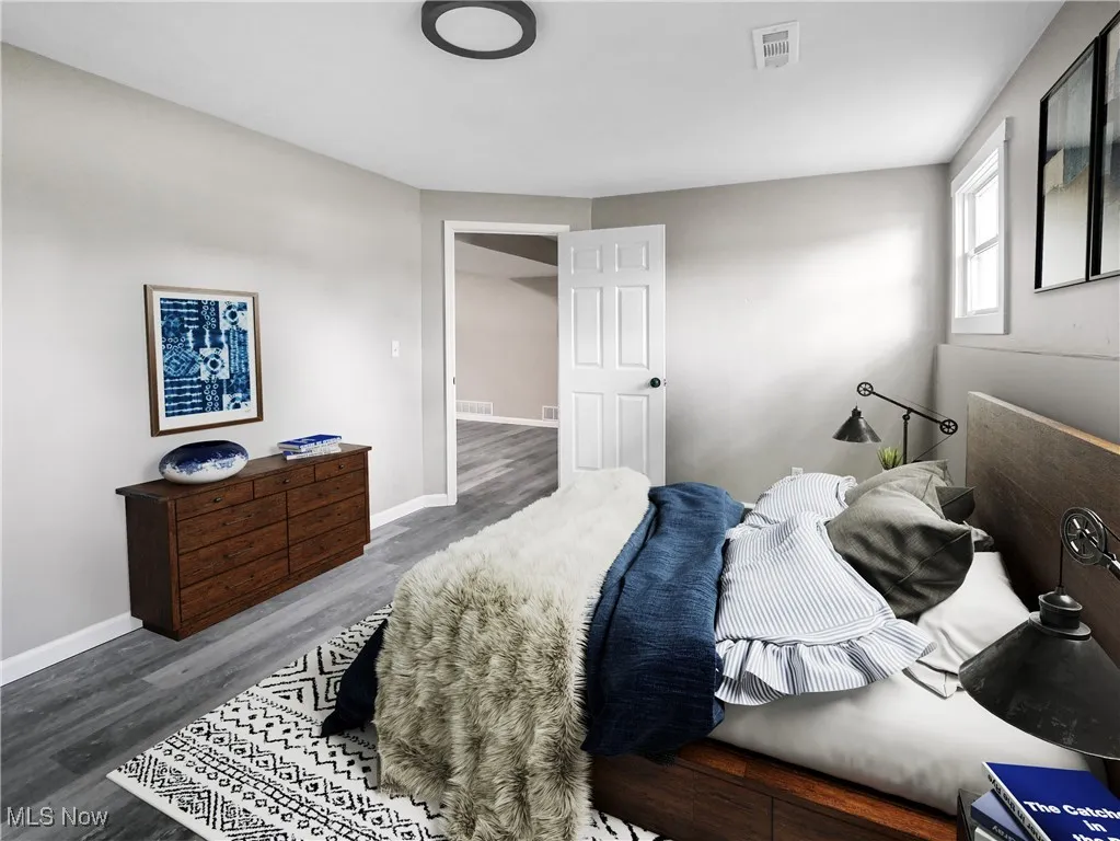 Bedroom with wood finished floors