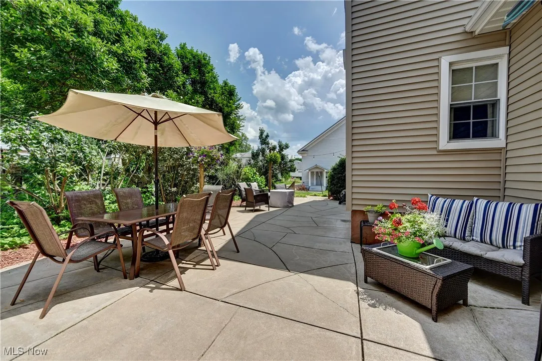 View of patio with outdoor dining area and an outdoor hangout area