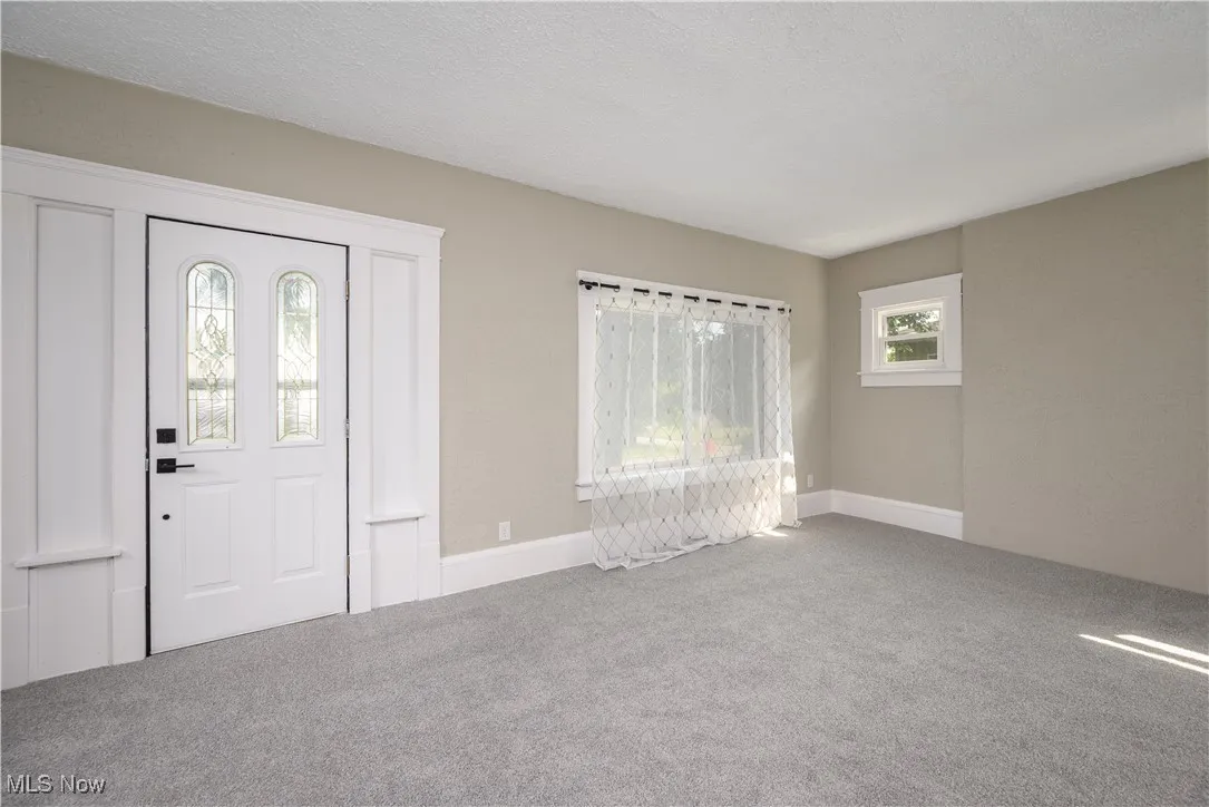 Entryway featuring carpet floors