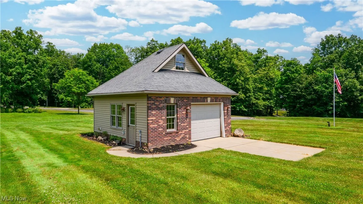 Carriage House boasts additional 1 car garage & attic storage.