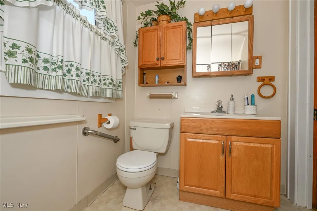 Bathroom with vanity and toilet