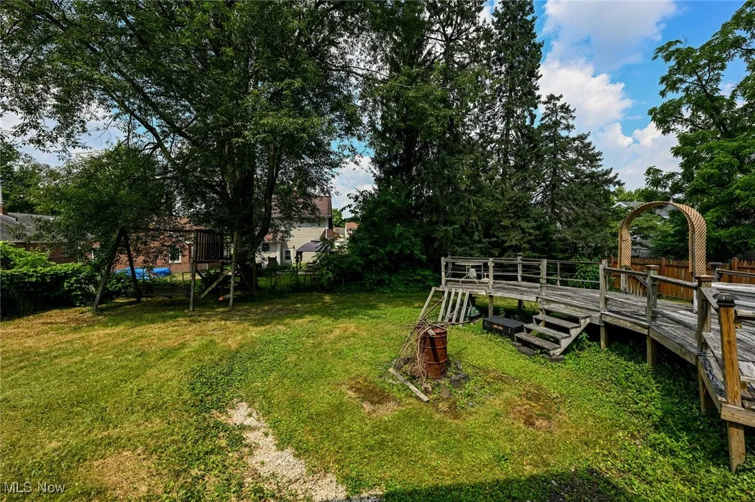 View of yard featuring a wooden deck