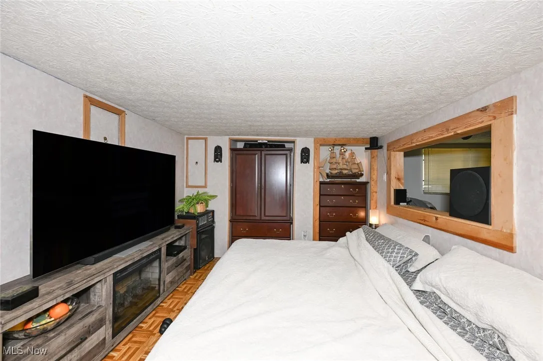 Bedroom featuring a textured ceiling