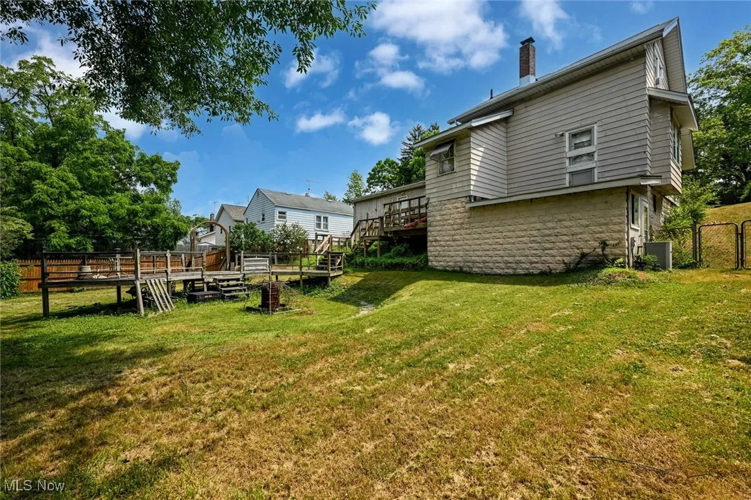 View of yard with a wooden deck