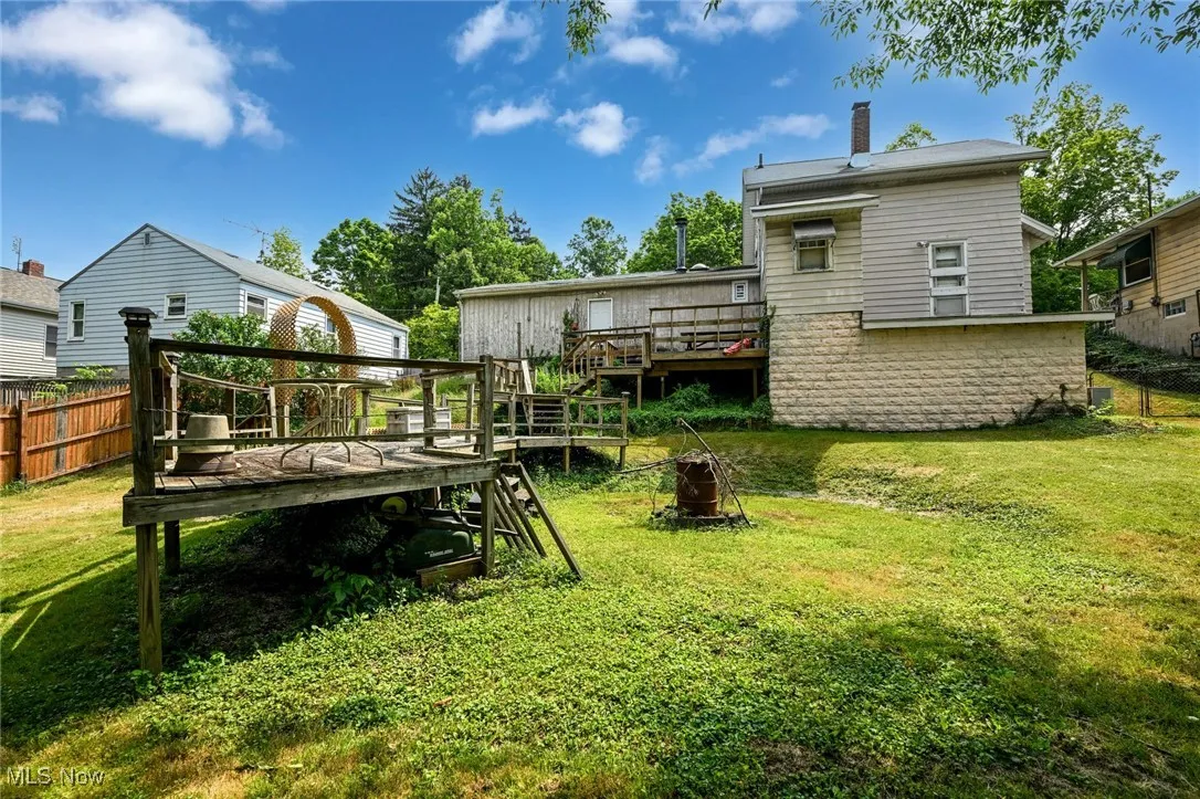 View of yard featuring a wooden deck