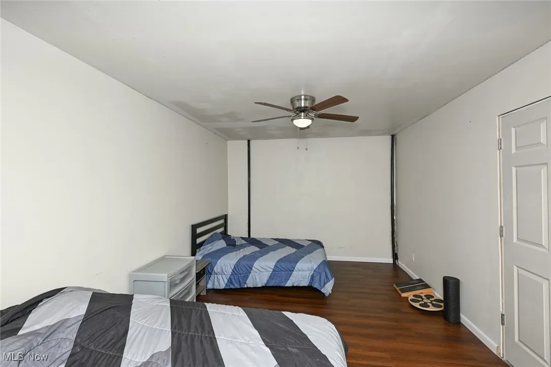 Bedroom with wood finished floors and a ceiling fan