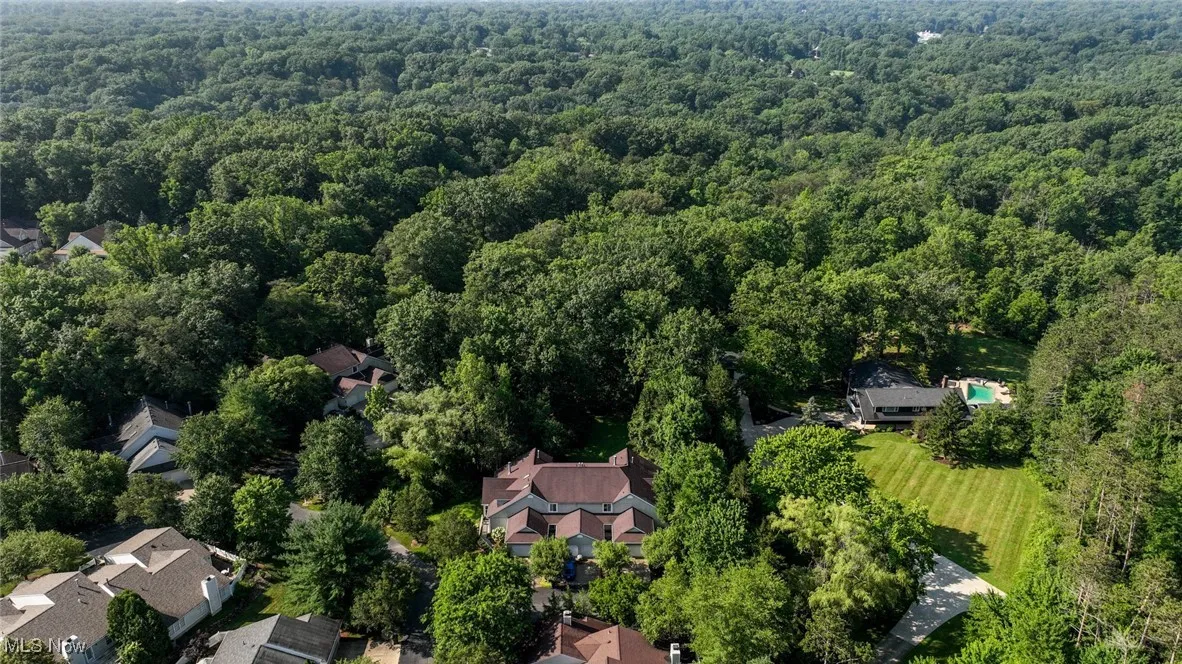Aerial overview of property's location with a forest