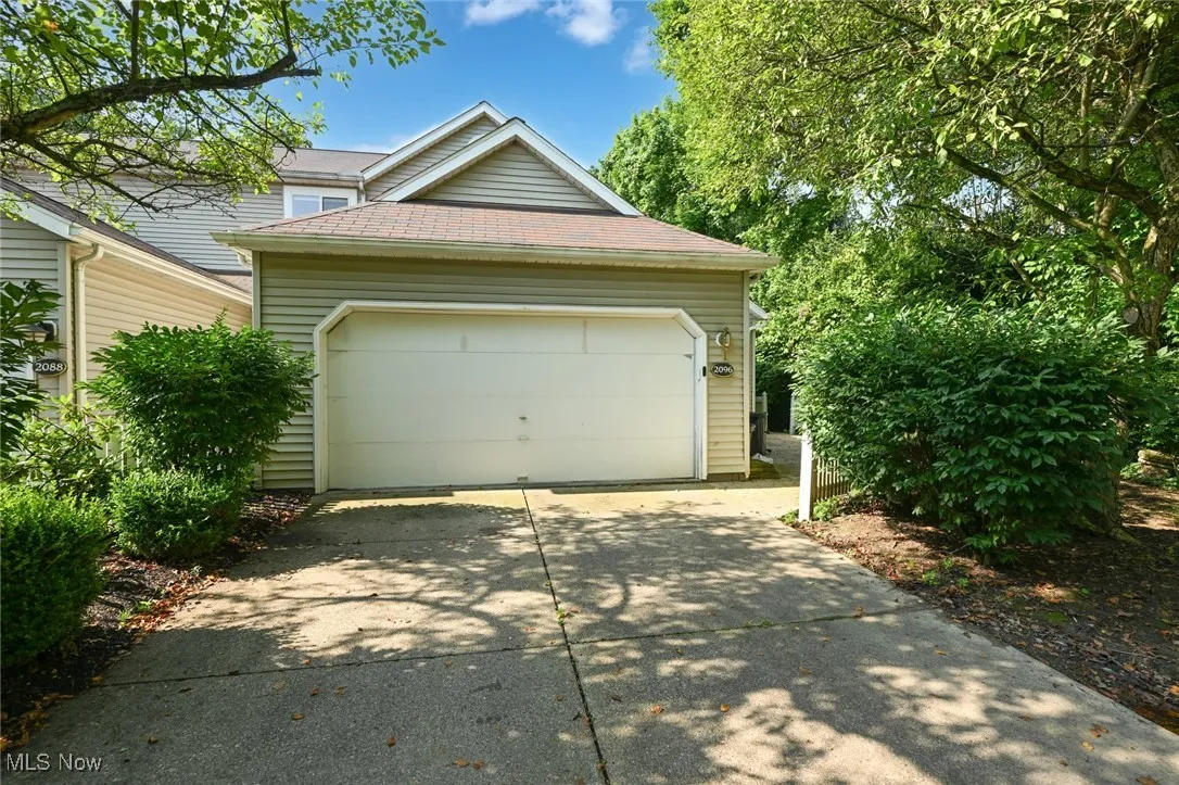 Garage with concrete driveway