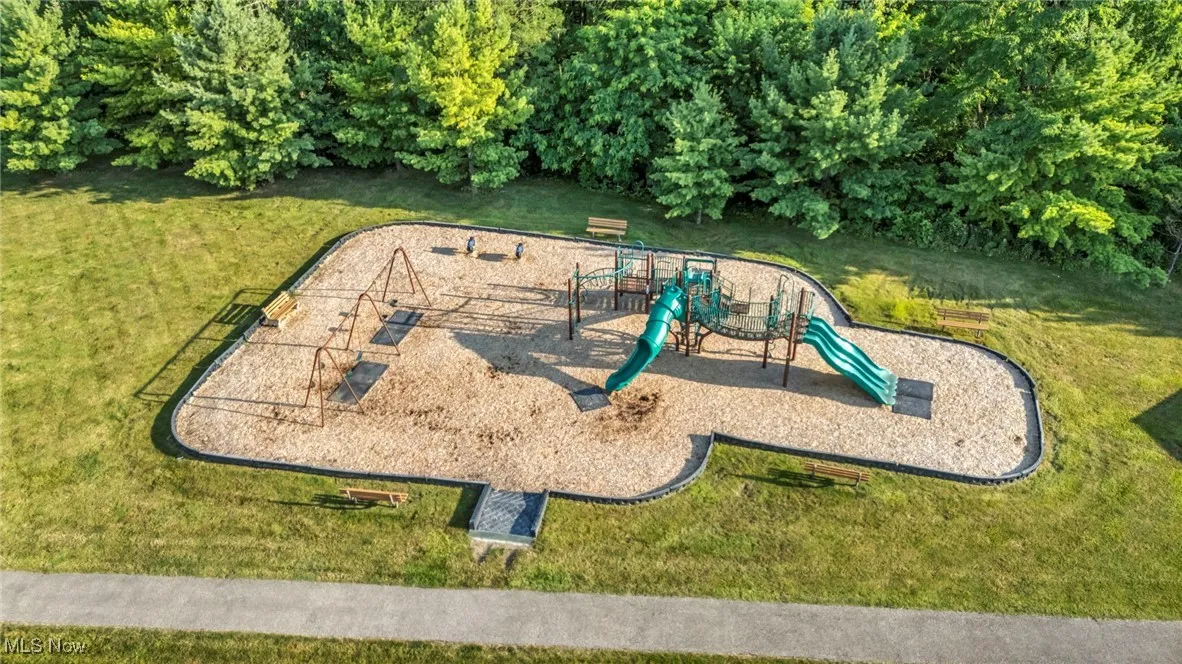 View of playground featuring a lawn