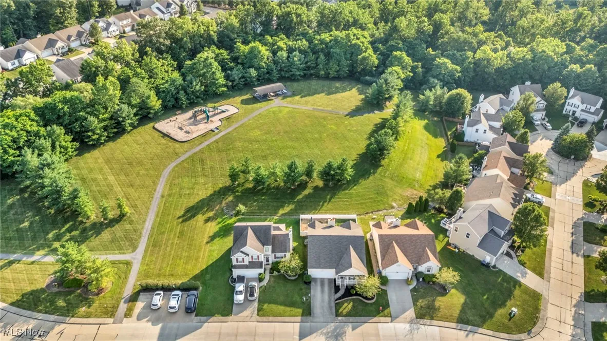 Aerial view of property's location with nearby suburban area