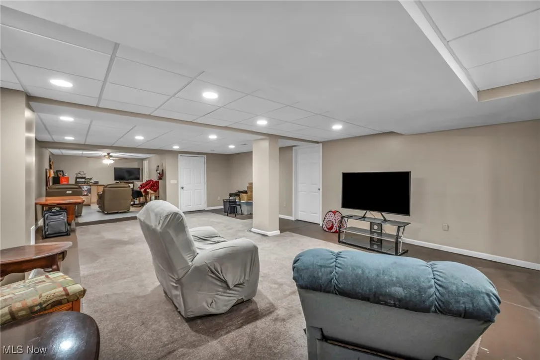 Living room with baseboards and recessed lighting