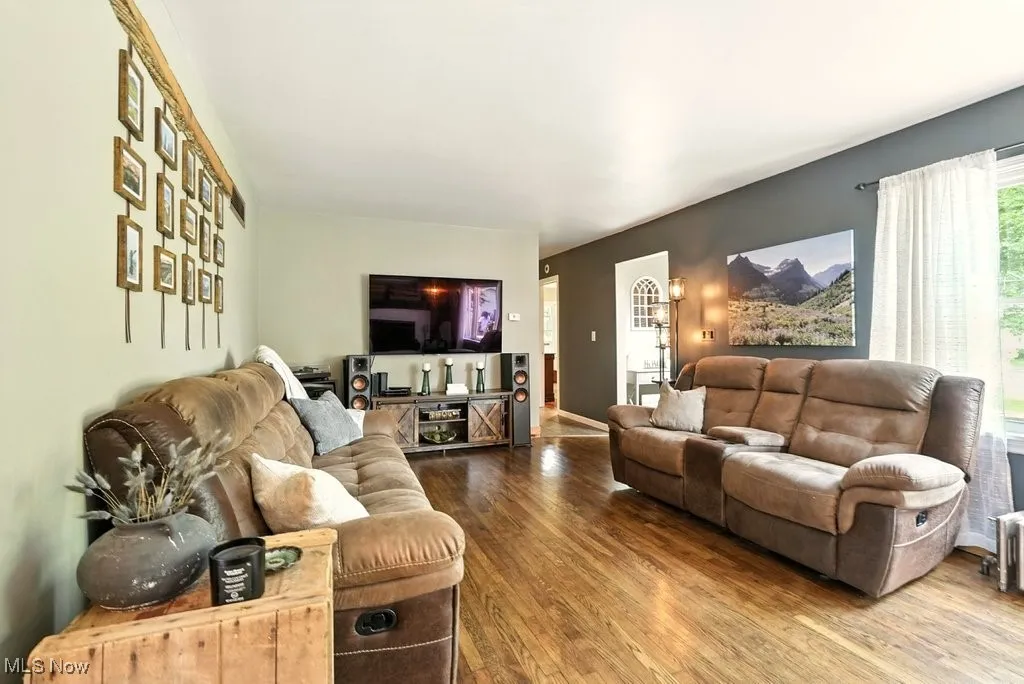 Living Room with Brick Wood-Burning Fireplace with Hearth