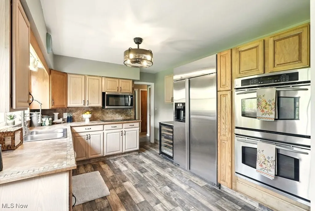 Kitchen with Stainless Steel Appliances and Tile Counter