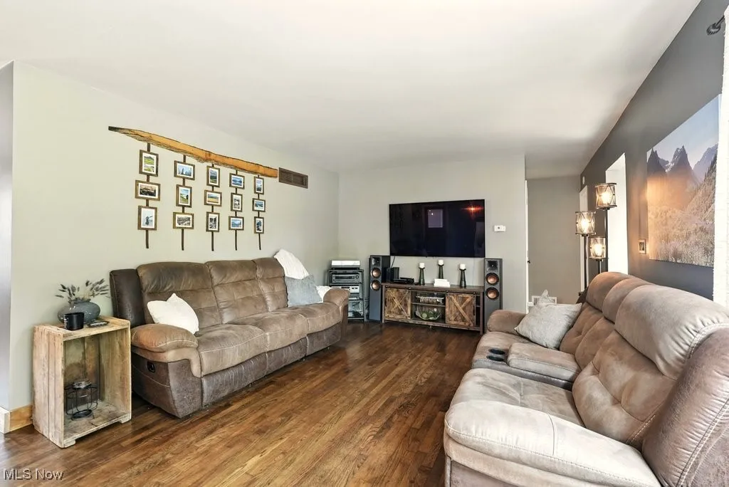 Living Room with Brick Wood-Burning Fireplace with Hearth