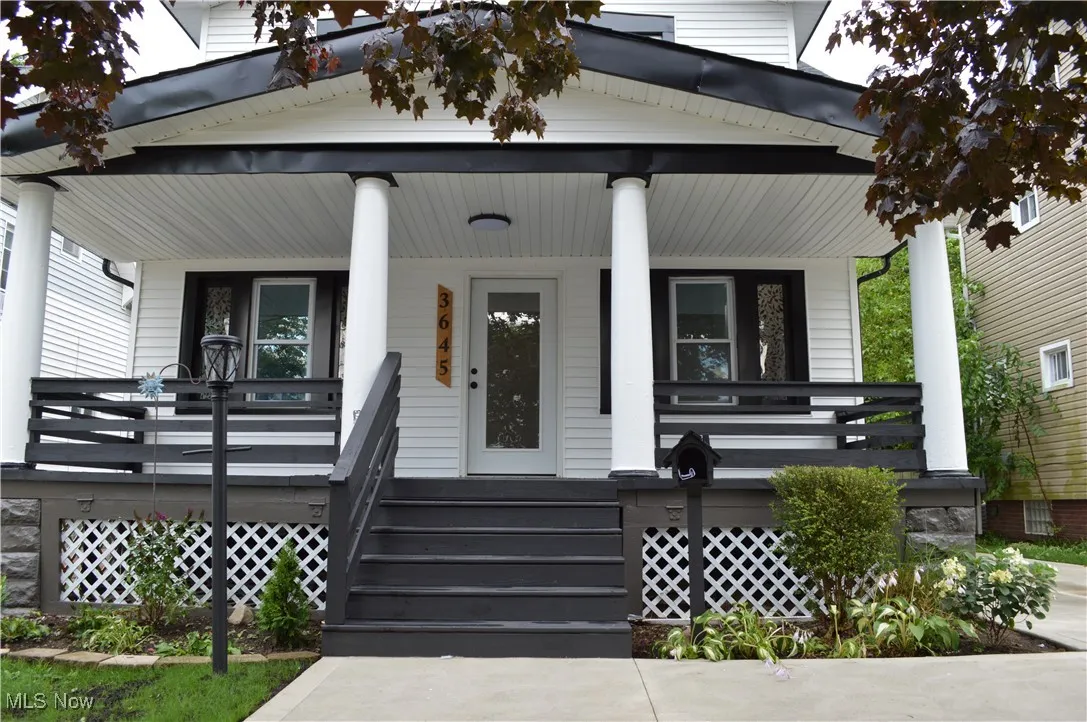 View of exterior entry with covered porch