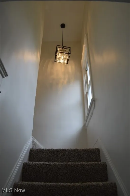 Staircase with a chandelier