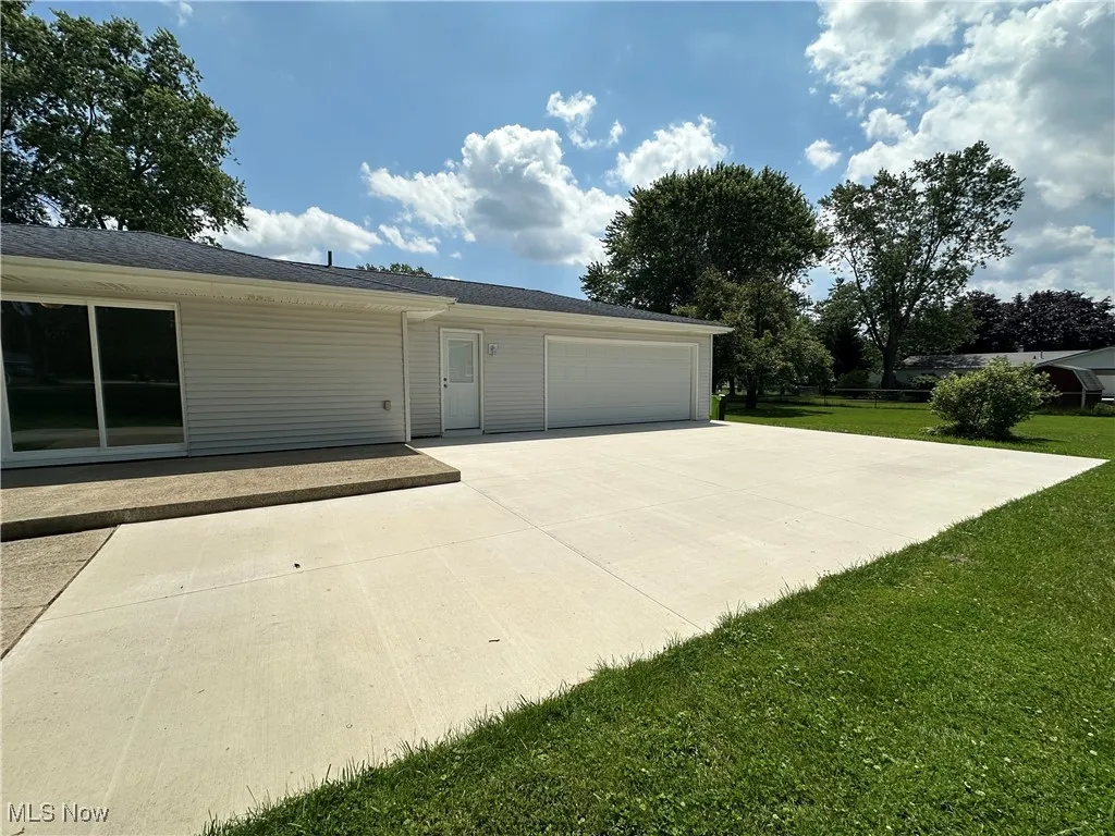 Garage with concrete driveway