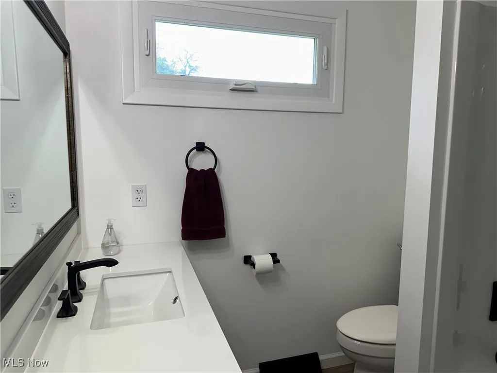 Bathroom featuring healthy amount of natural light and vanity