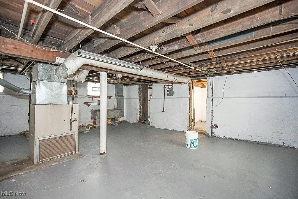 Unfinished basement with heating unit