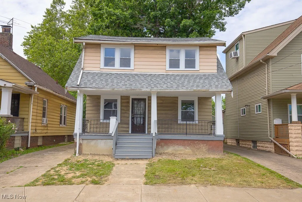 View of front of property featuring covered porch, roof with shingles, and cooling unit