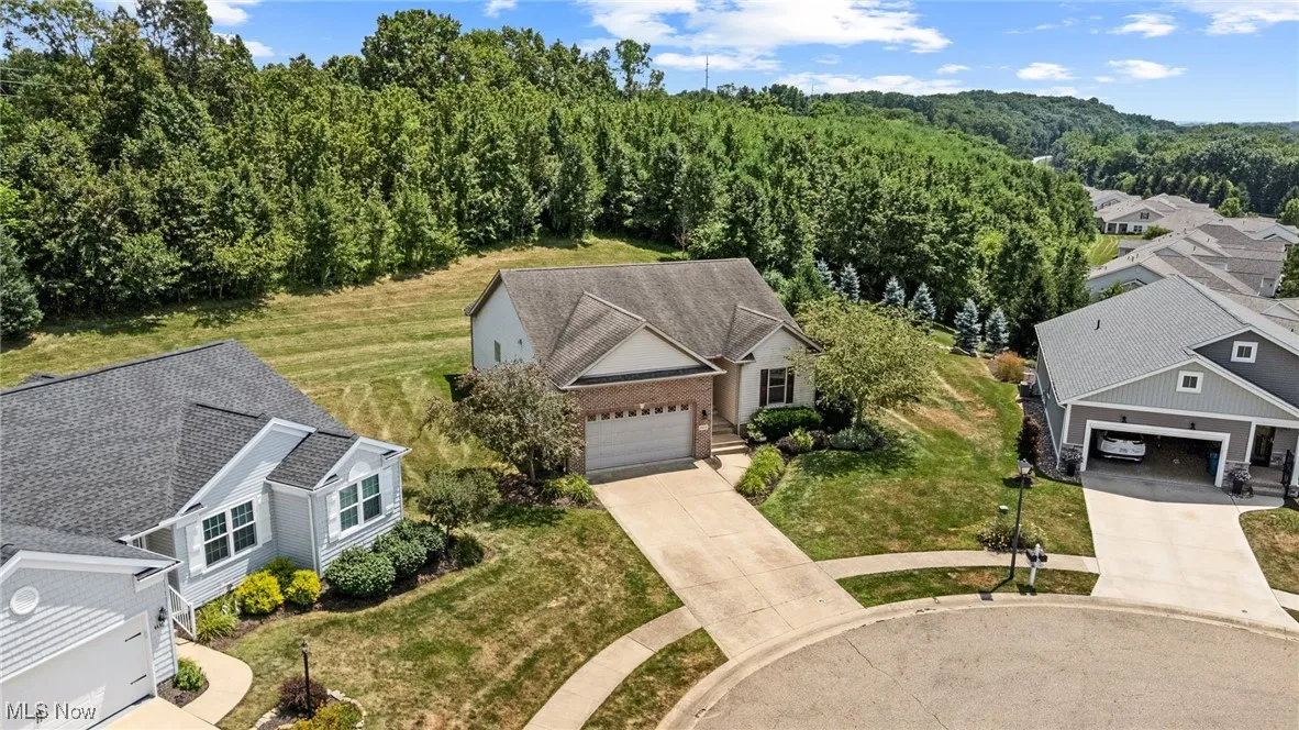 View from above of property featuring a heavily wooded area
