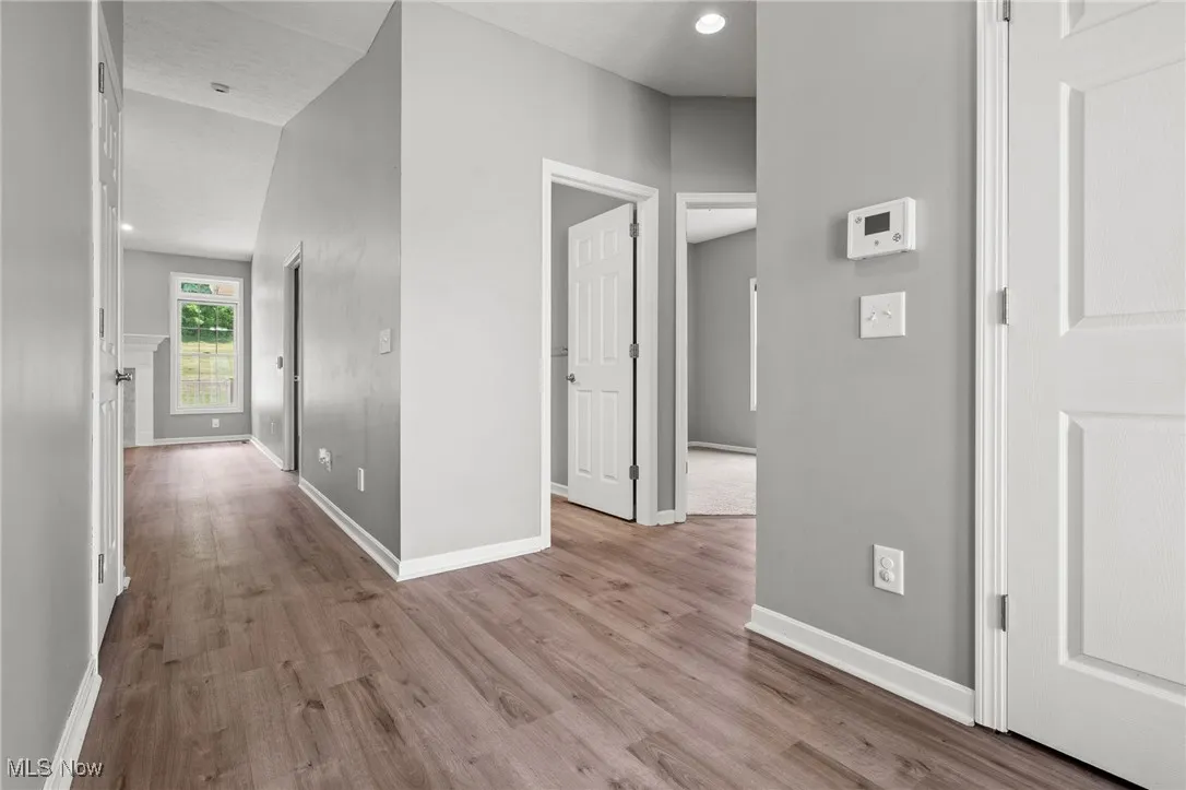 Hall featuring wood finished floors
