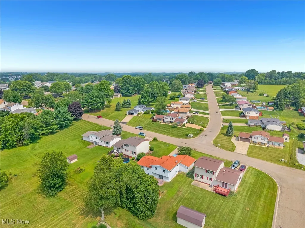 View of property location with nearby suburban area