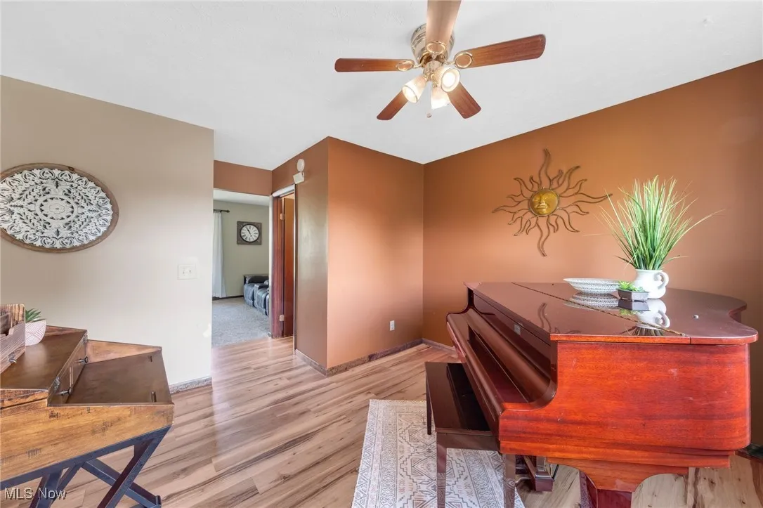 Office featuring light wood-style floors and a ceiling fan