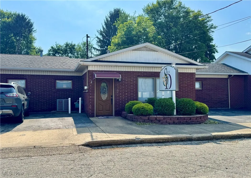 Business with brick siding and concrete driveway