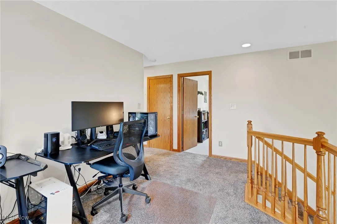 Office space featuring carpet flooring and baseboards