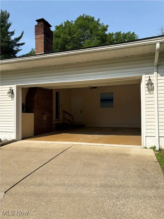 Garage with concrete driveway
