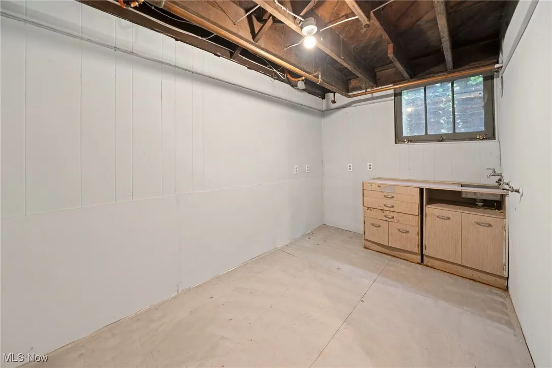 Basement featuring a sink