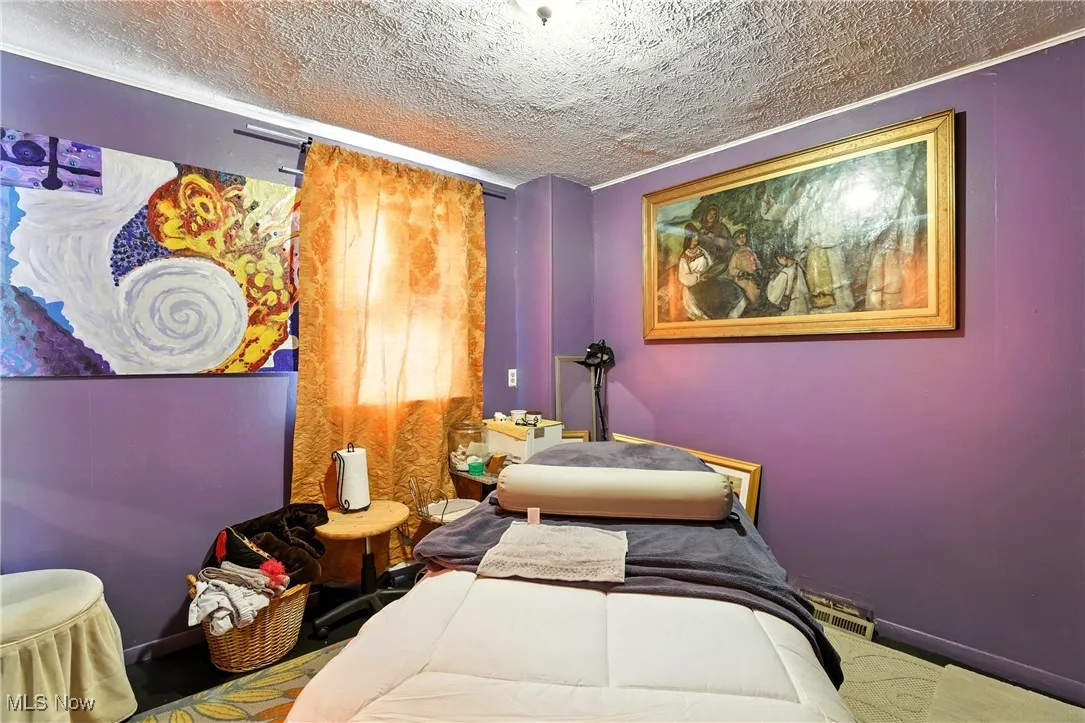 Bedroom featuring a textured ceiling