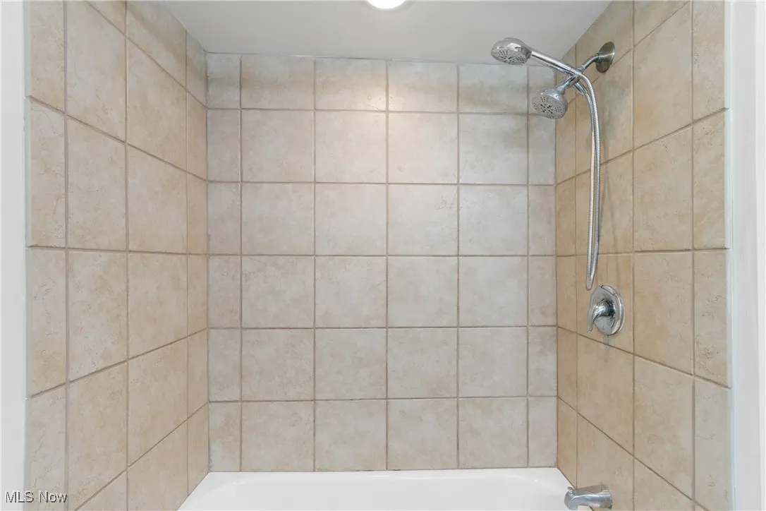 Bathroom with a shower and a bath