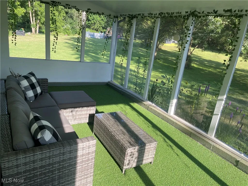 Sunroom featuring plenty of natural light