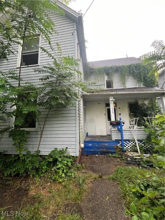 View of front of house with covered porch