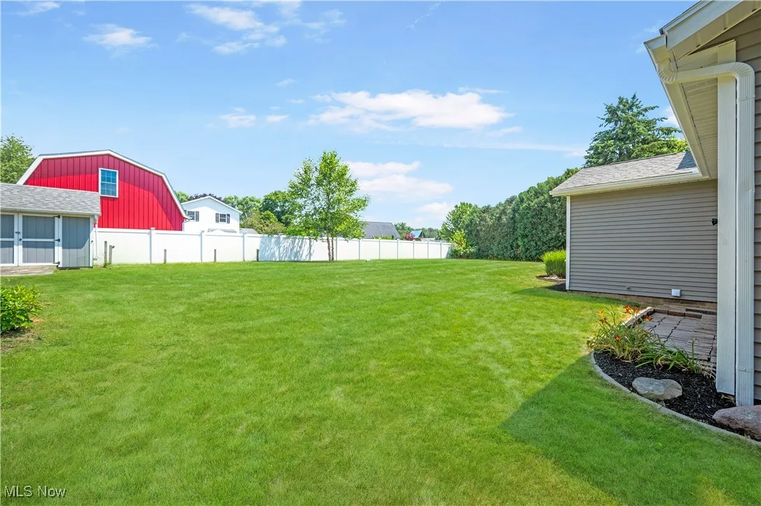 View of yard with an outbuilding