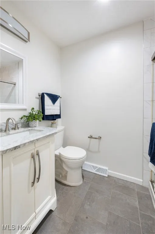 Full bath featuring vanity and a shower with shower door