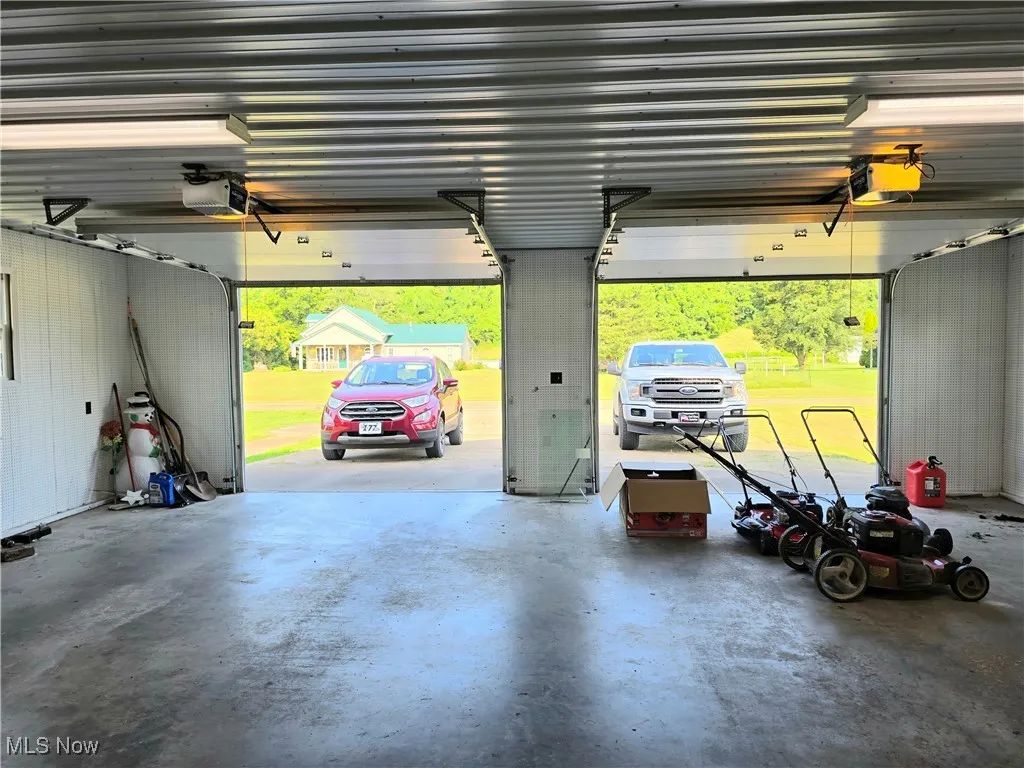 Garage featuring a garage door opener