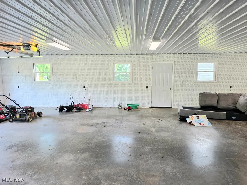 Garage featuring a garage door opener