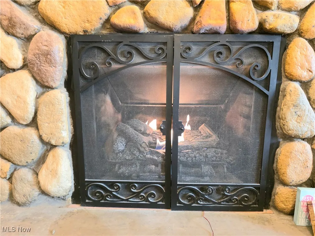 Detailed view of gas log fireplace