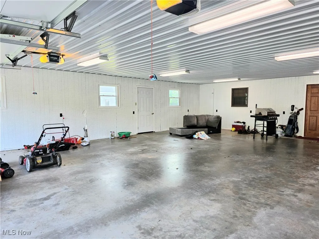 Garage featuring a garage door opener