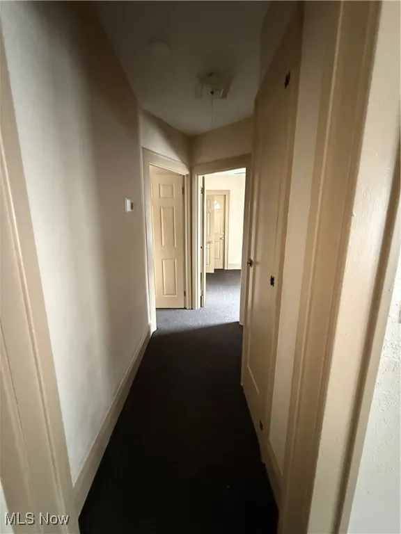 Corridor with dark carpet