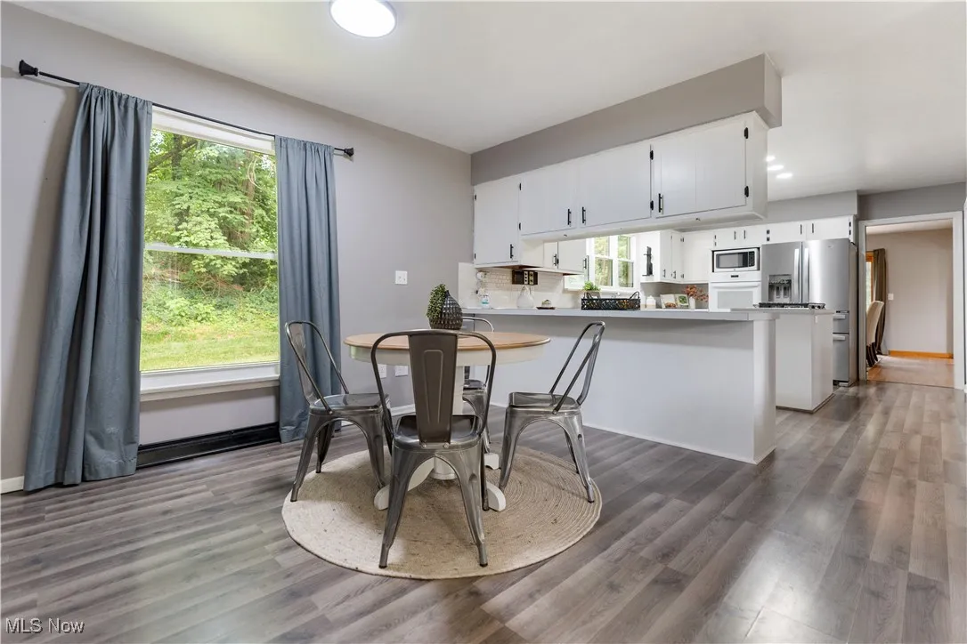 Dining space with wood finished floors