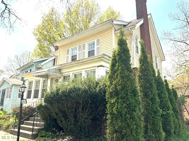 View of front of home with a chimney
