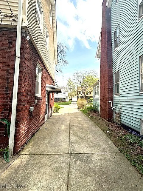 View of side of home featuring brick siding